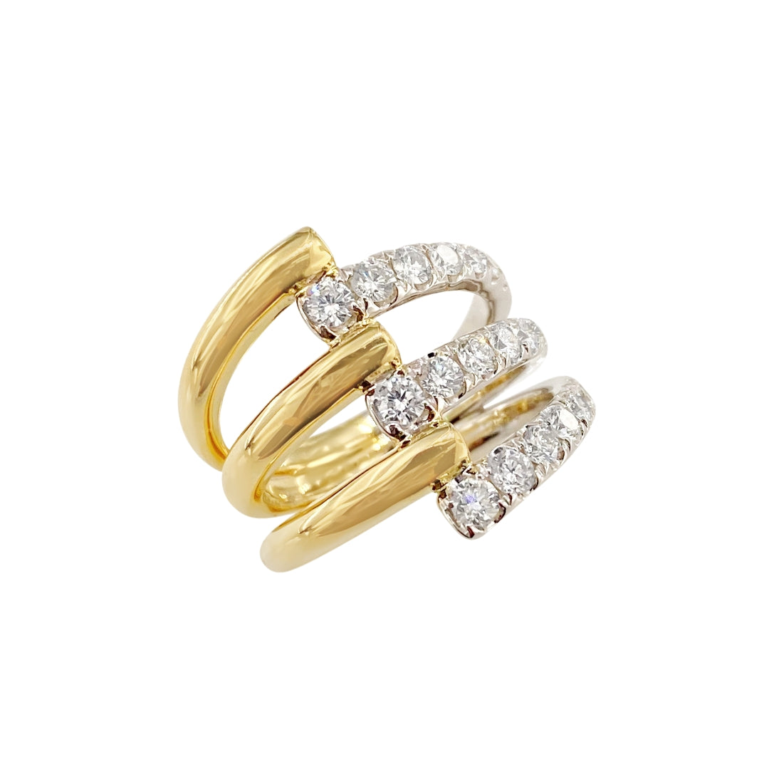 A two-tone diamond statement ring with a gold band and multiple diamond accents.