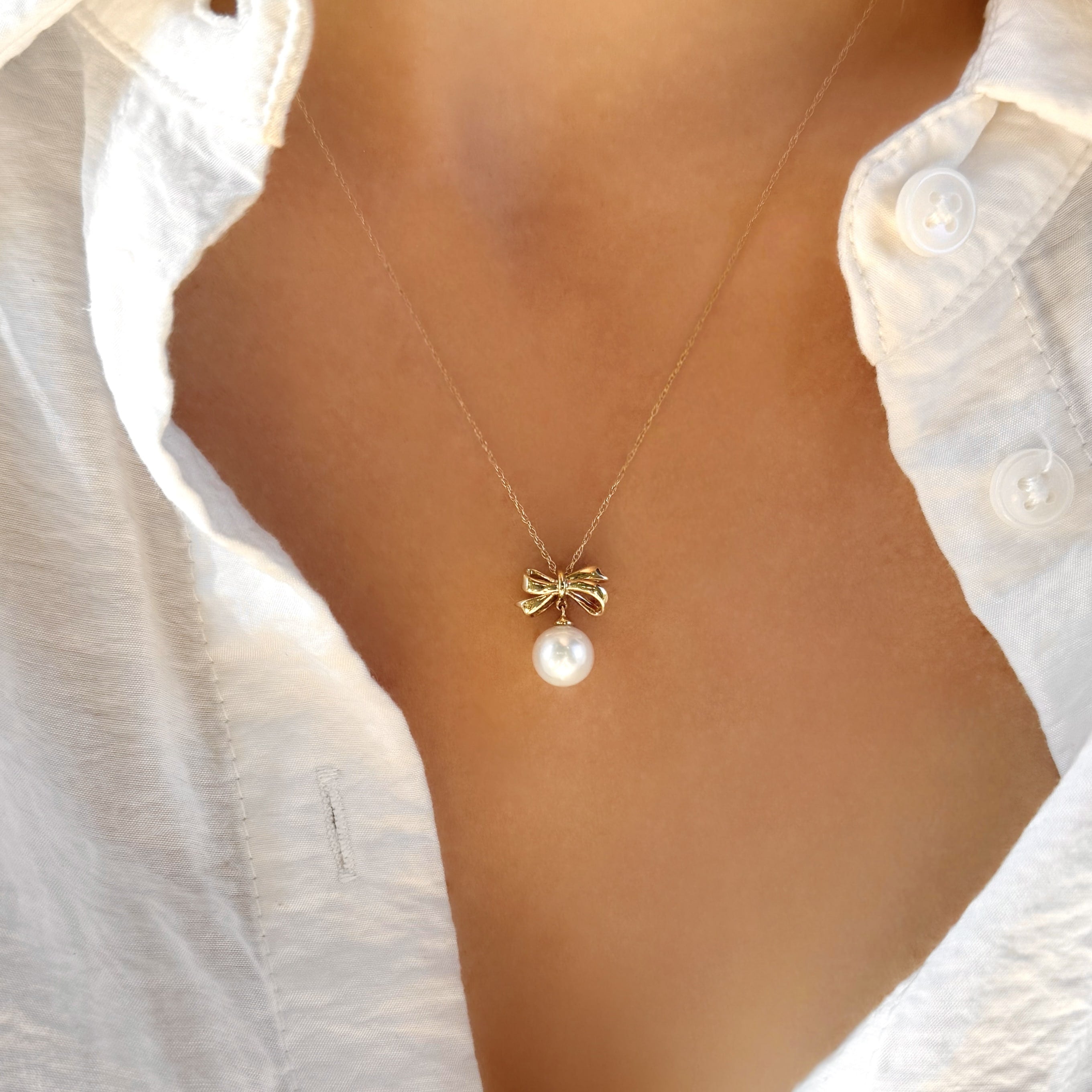 Gold Bow and Pearl Necklace