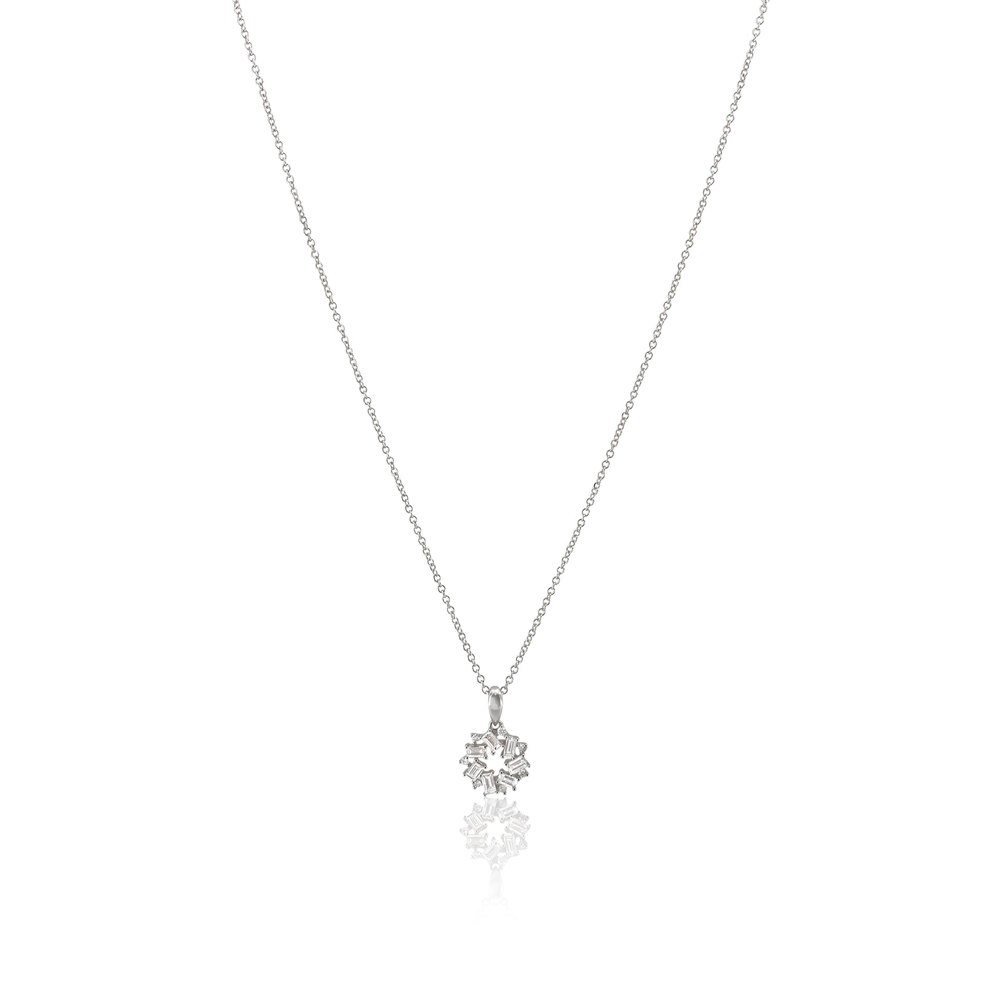 San Antonio Jewelry baguette diamond pendant with round diamond accents in 18k white gold. 
