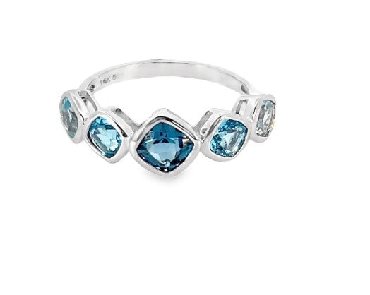 GRADUATING BLUE TOPAZ RING IN WHITE GOLD