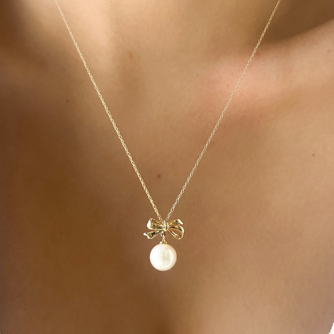 Gold Bow and Pearl Necklace